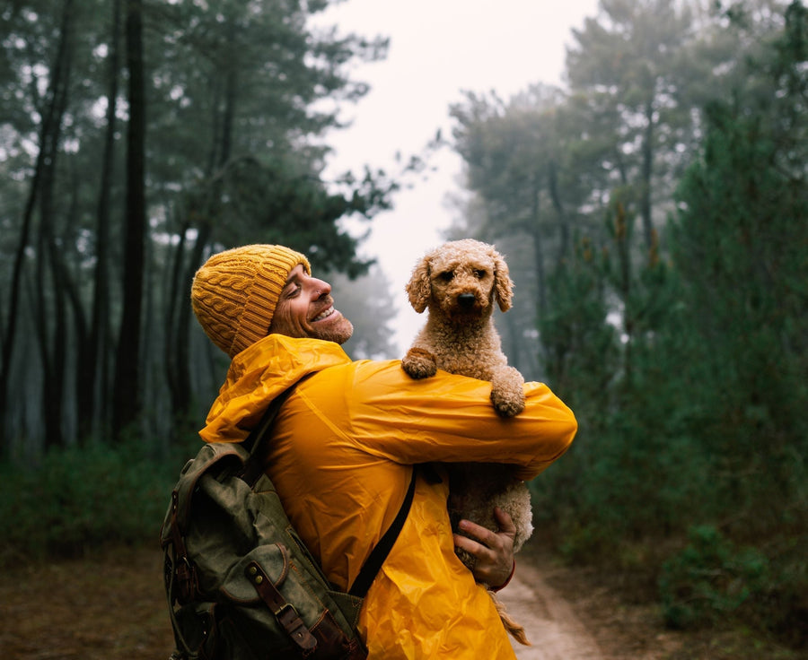 happy man holding new puppy