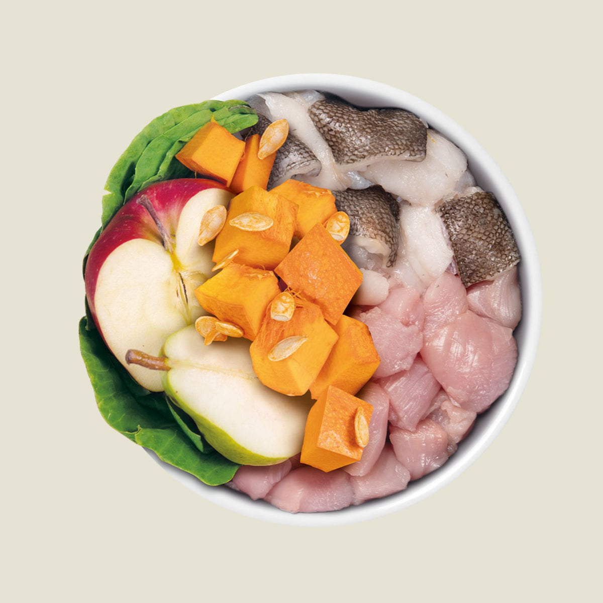 Assorted raw meat and vegetables in a bowl on a beige background
